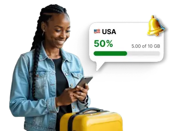 Traveler checking mobile data usage for the USA in an app, with a notification showing 50% of the 10 GB data package used.